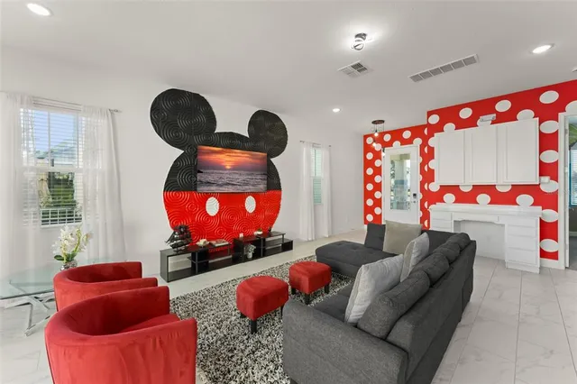 a living room with furniture a rug and a couch