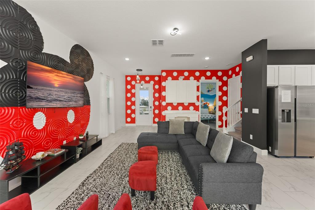 1531 Fairview Circle Reunion, FL 34747 - Photo 7 of 42 a living room with furniture and a flat screen tv