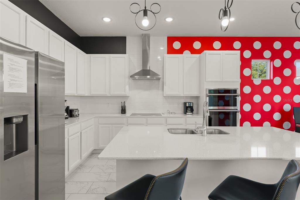 1531 Fairview Circle Reunion, FL 34747 - Photo 9 of 42 a kitchen with stainless steel appliances kitchen island granite countertop a sink and cabinets