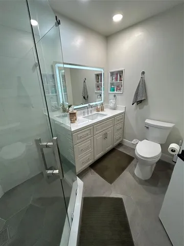 a bathroom with a sink and shower