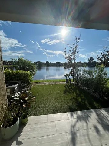 a living room with a bed and a chair