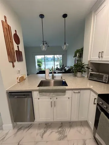 a kitchen with a sink and cabinets