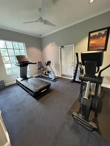 a view of a street with a cars parked and palm trees