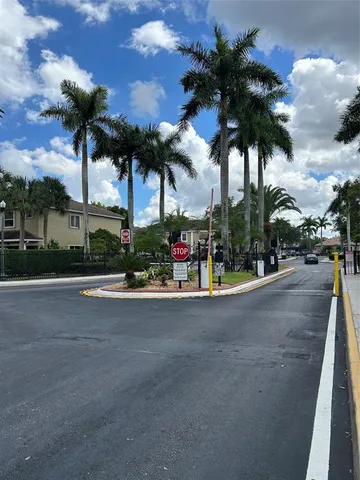a view of a city with palm trees