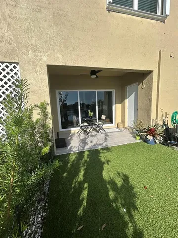 a view of a swimming pool with a table and chairs