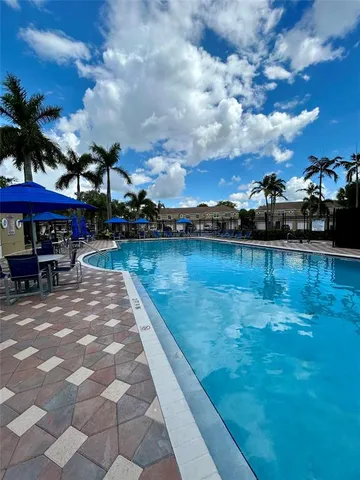 a view of a lake with sitting area
