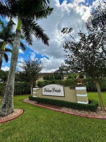 a view of tennis ground with lots of trees