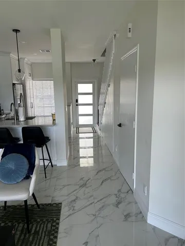 a view of kitchen with furniture and window