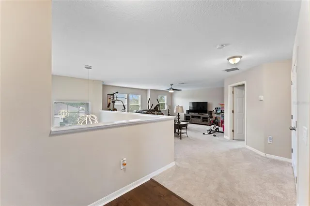 a spacious bedroom with a bed a couch and a fireplace