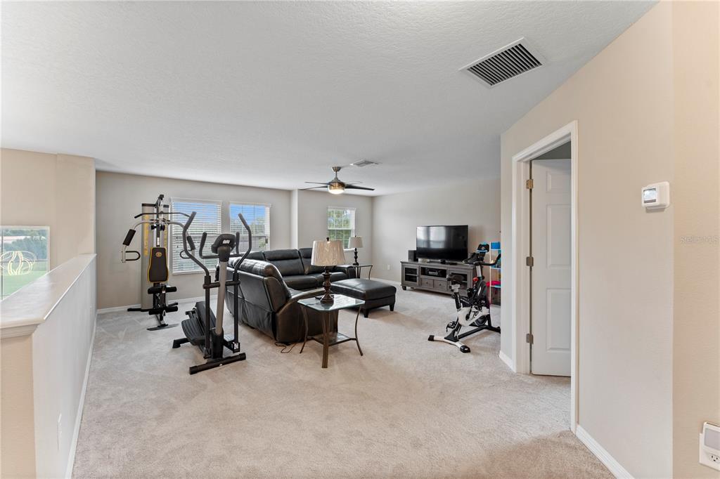 19065 Malinche Loop Spring Hill, FL 34610 - Photo 36 of 72 a view of a livingroom with workspace and a window