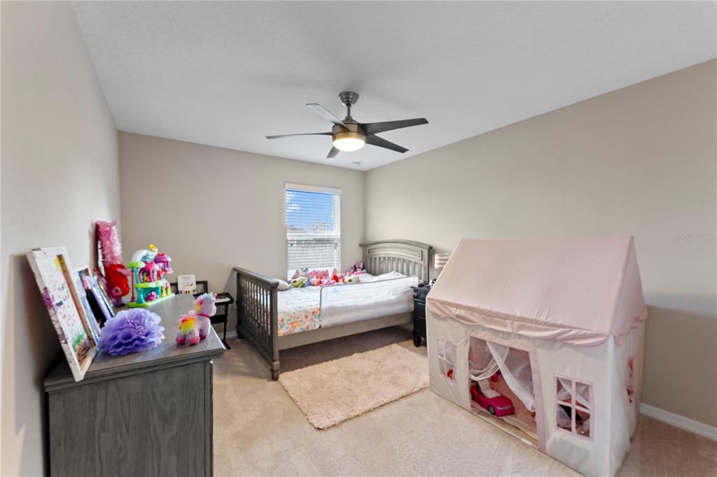 19065 Malinche Loop Spring Hill, FL 34610 - Photo 40 of 72 a living room with furniture and a chandelier