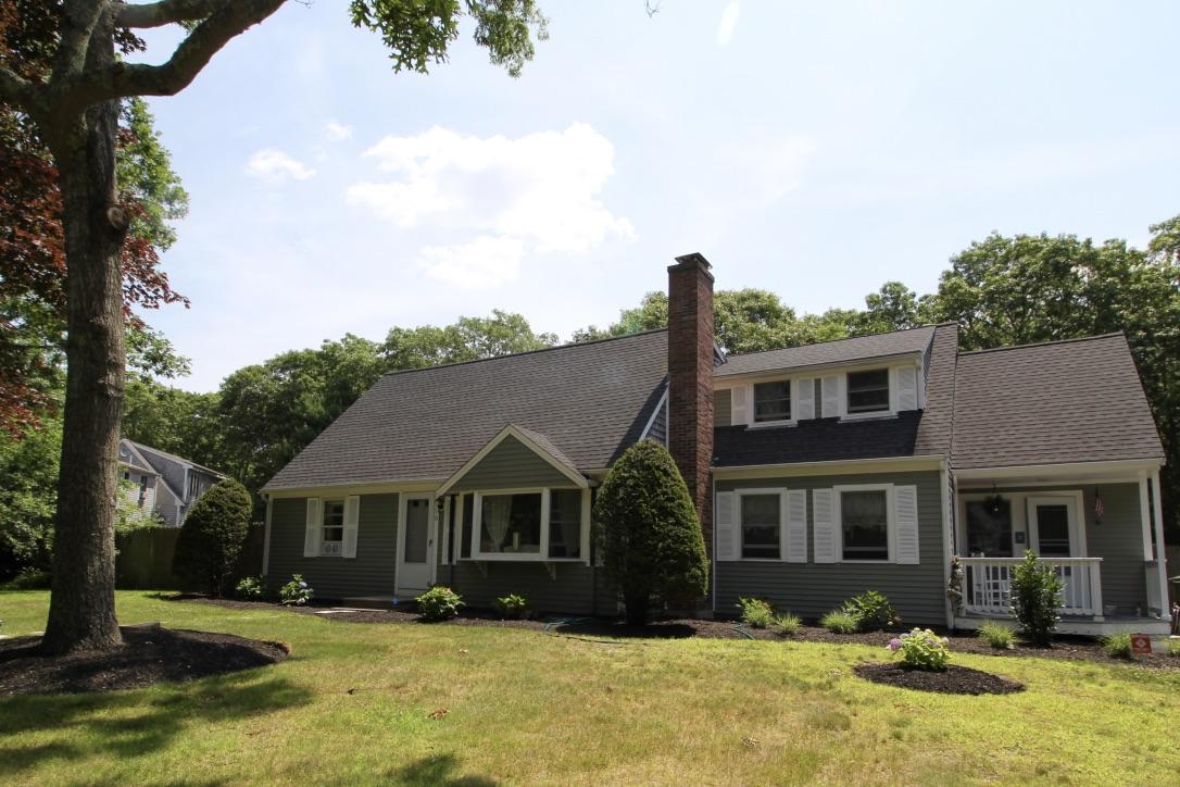 10 Lan Road Sandwich, MA 02563 - Photo 1 of 35 a front view of a house with a yard