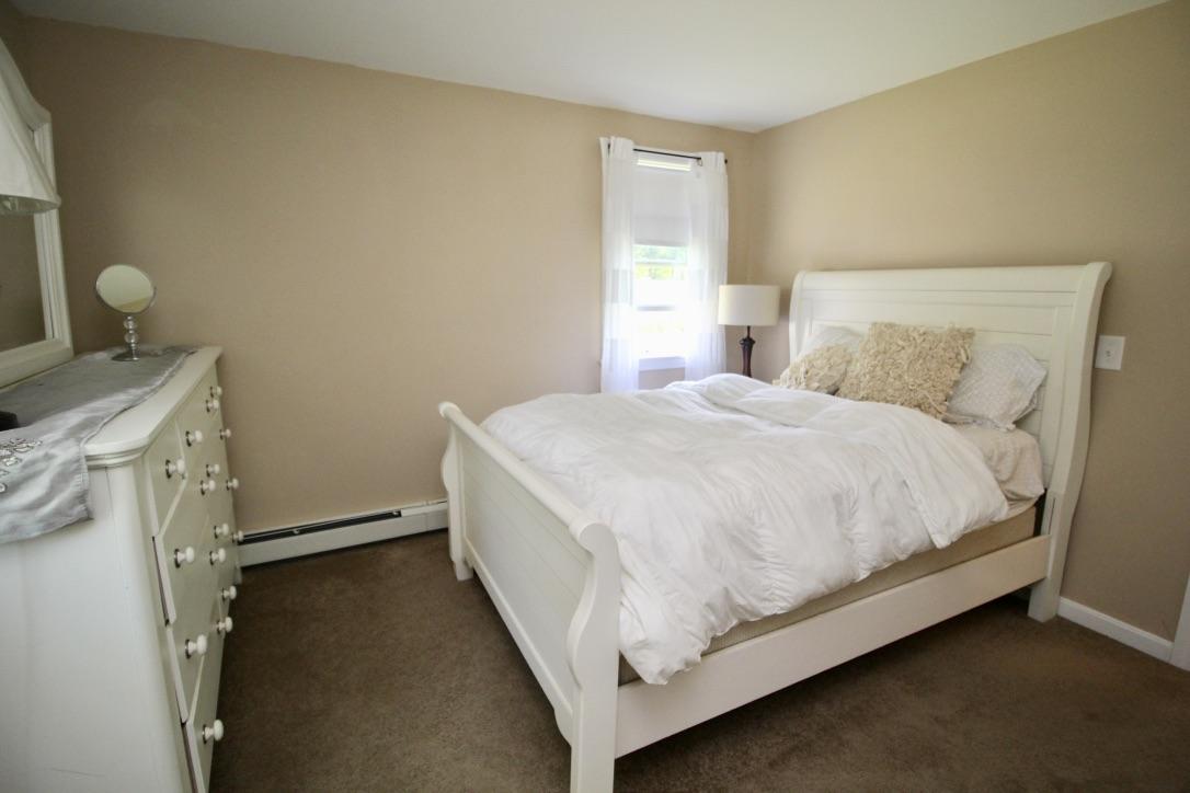 10 Lan Road Sandwich, MA 02563 - Photo 14 of 35 a bed room with a bed and a window