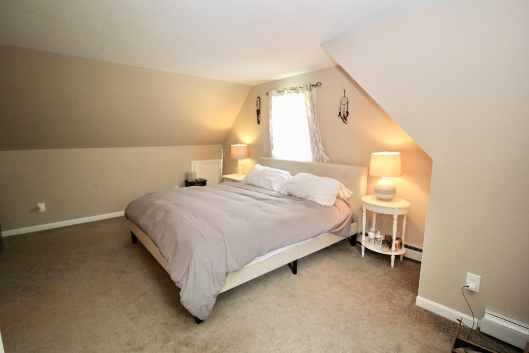 10 Lan Road Sandwich, MA 02563 - Photo 19 of 35 a bedroom with a bed and a window