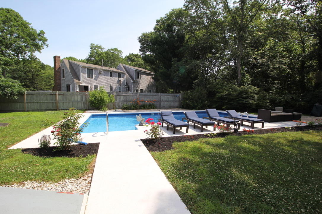 10 Lan Road Sandwich, MA 02563 - Photo 29 of 35 a view of a house with a yard patio and swimming pool