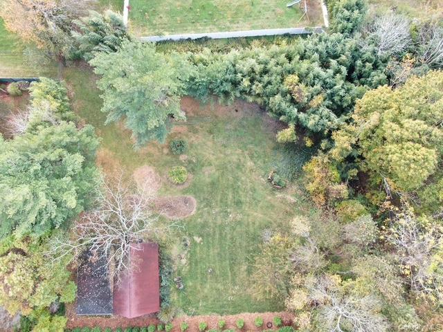 Lot D Merritts Path Rocky Point, NY 11778 - Photo 8 of 9 a picture of a tree with a yard