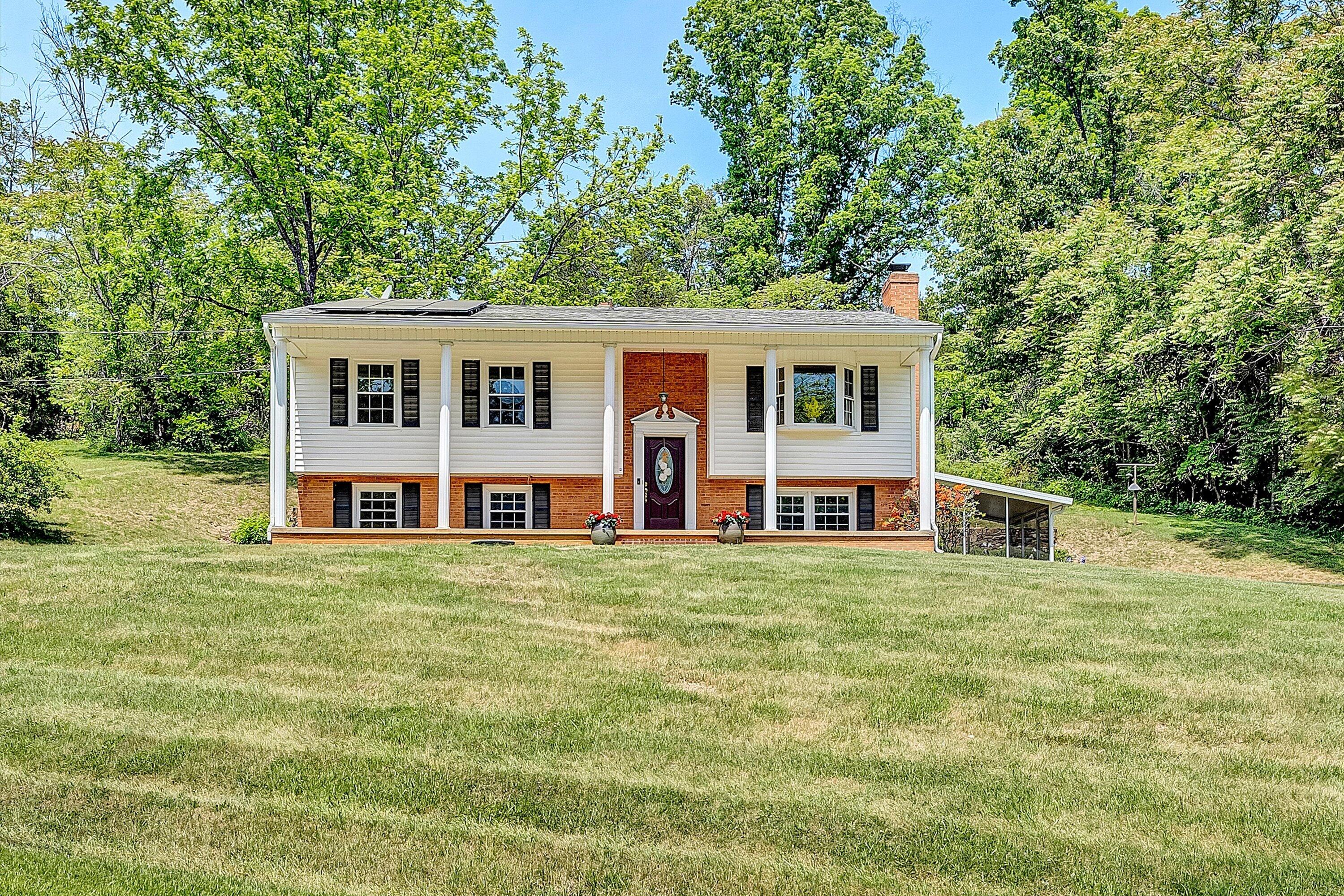 133 Kelsey Way Fincastle, VA 24090 - Photo 1 of 58 a front view of a house with a garden