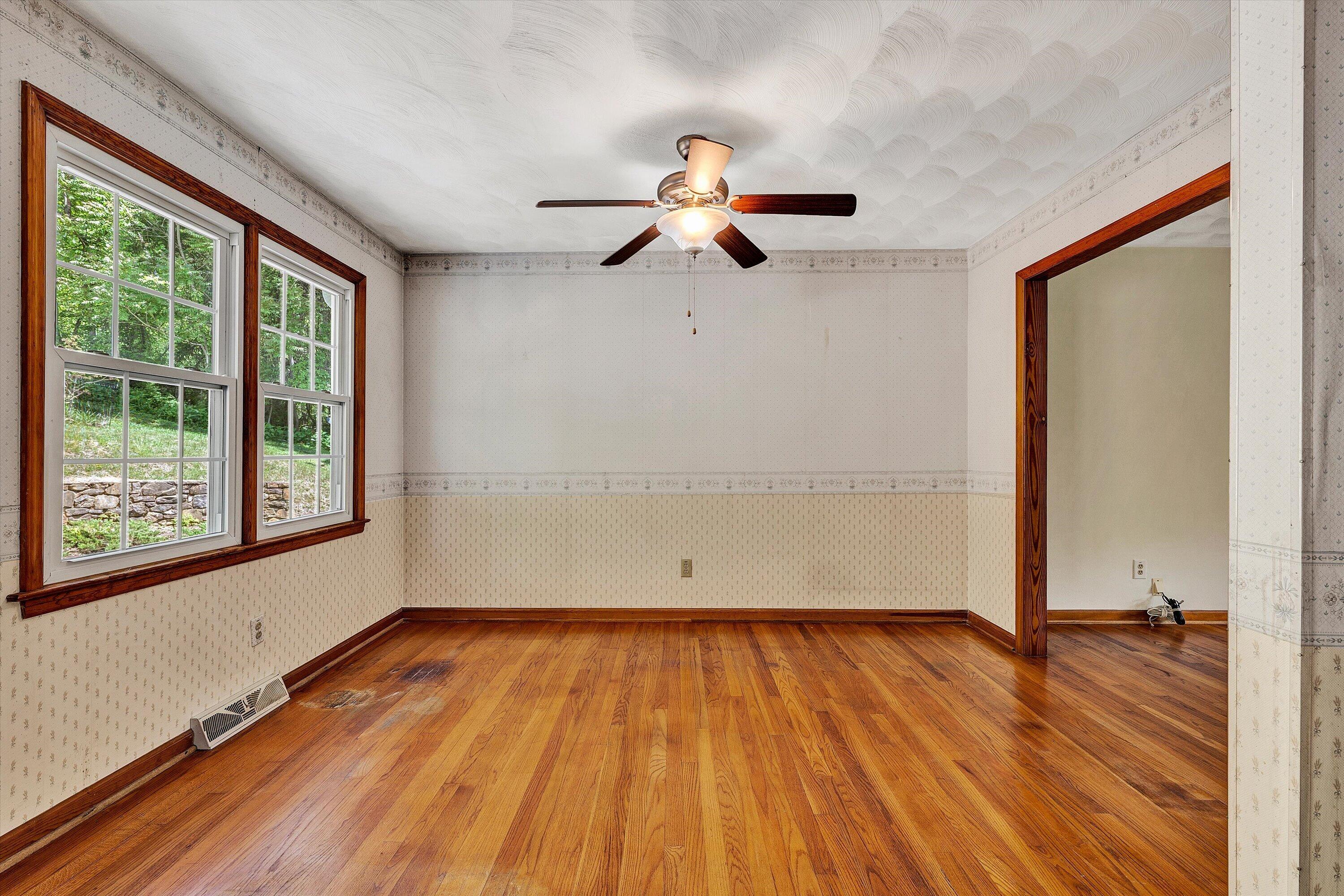 133 Kelsey Way Fincastle, VA 24090 - Photo 17 of 58 a view of empty room with wooden floor and fan