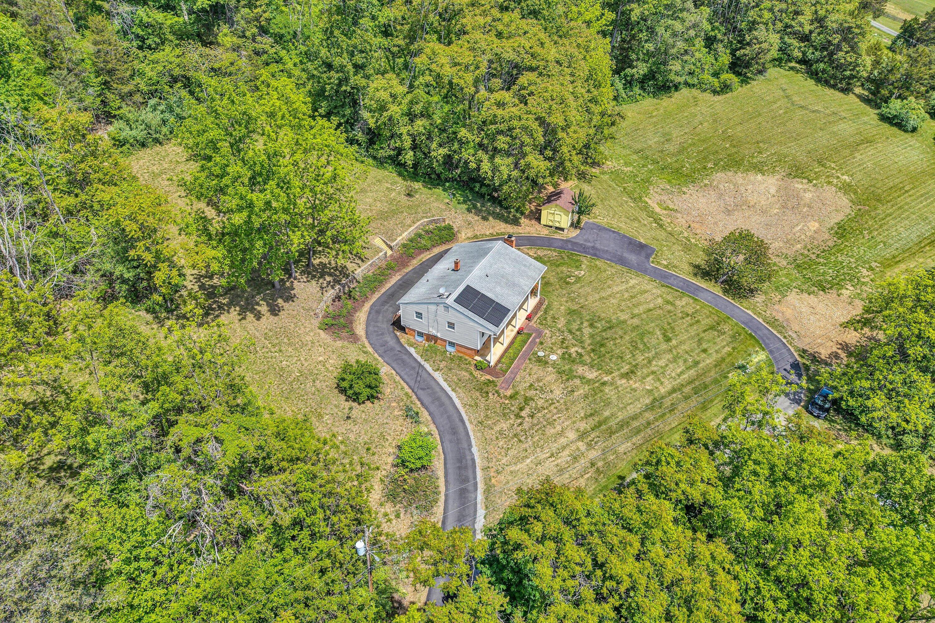 133 Kelsey Way Fincastle, VA 24090 - Photo 2 of 58 an aerial view of a house with a yard and large trees