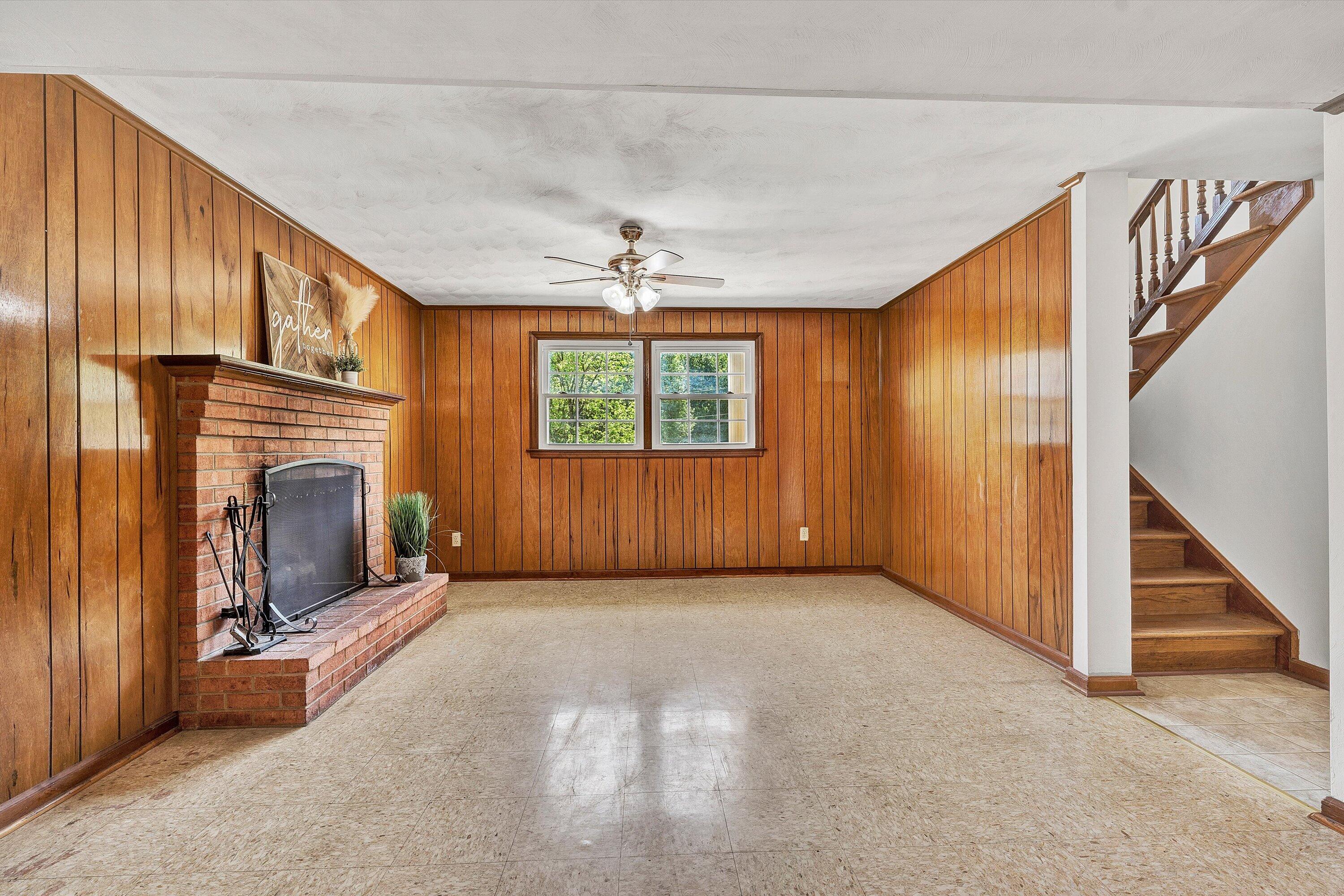 133 Kelsey Way Fincastle, VA 24090 - Photo 27 of 58 an empty room with windows & entryway fireplace