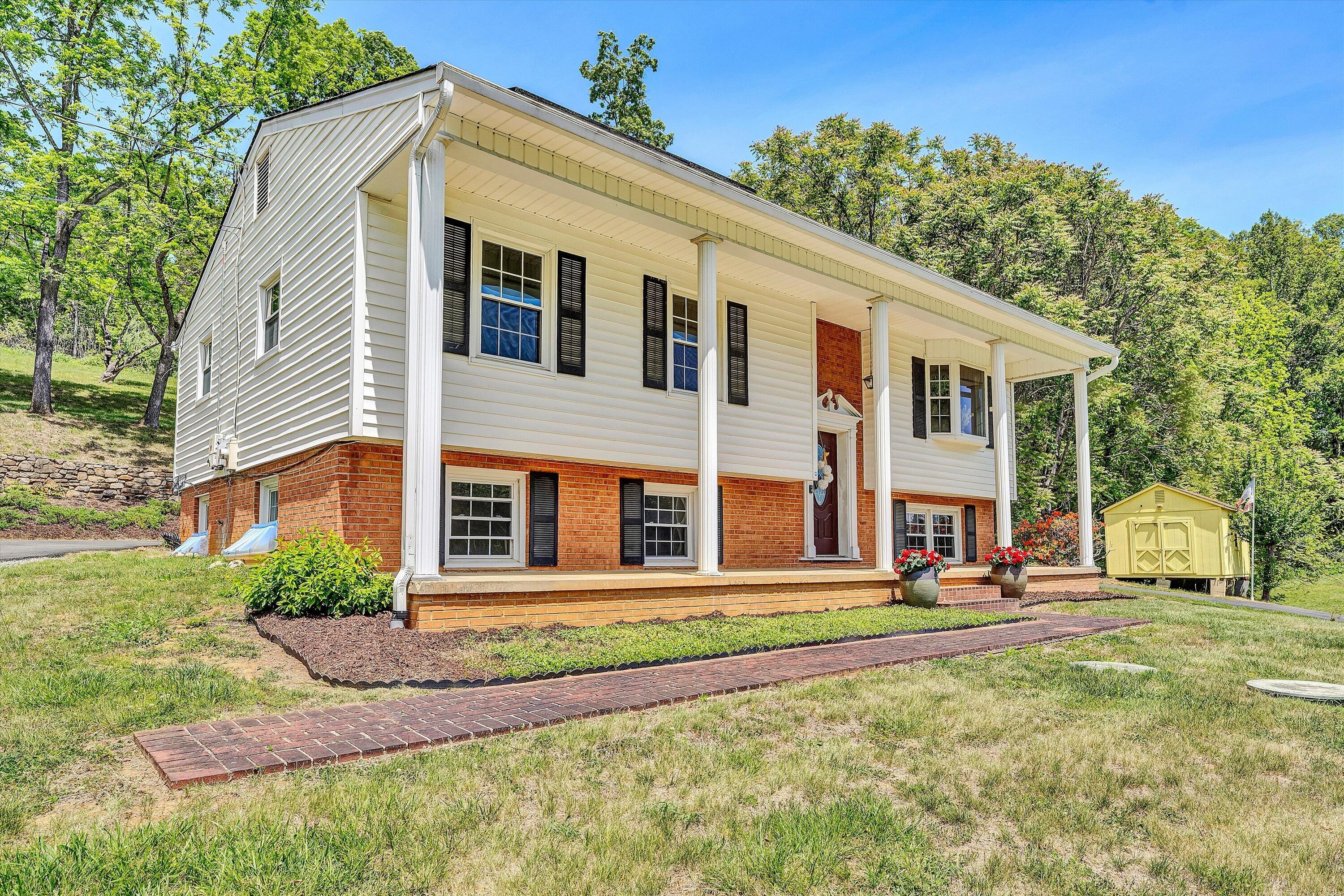 133 Kelsey Way Fincastle, VA 24090 - Photo 3 of 58 a front view of a house with a yard