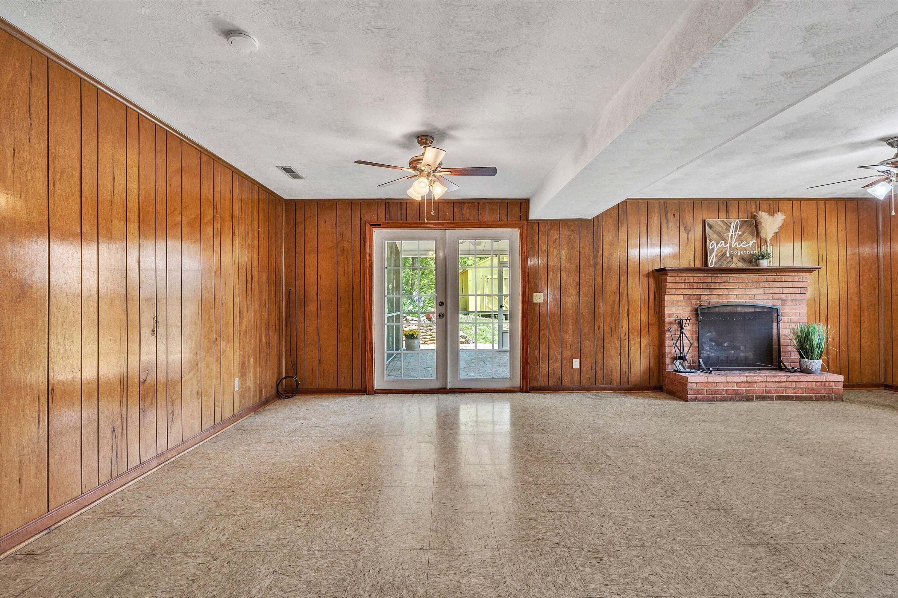 133 Kelsey Way Fincastle, VA 24090 - Photo 30 of 58 an empty room with windows and fireplace