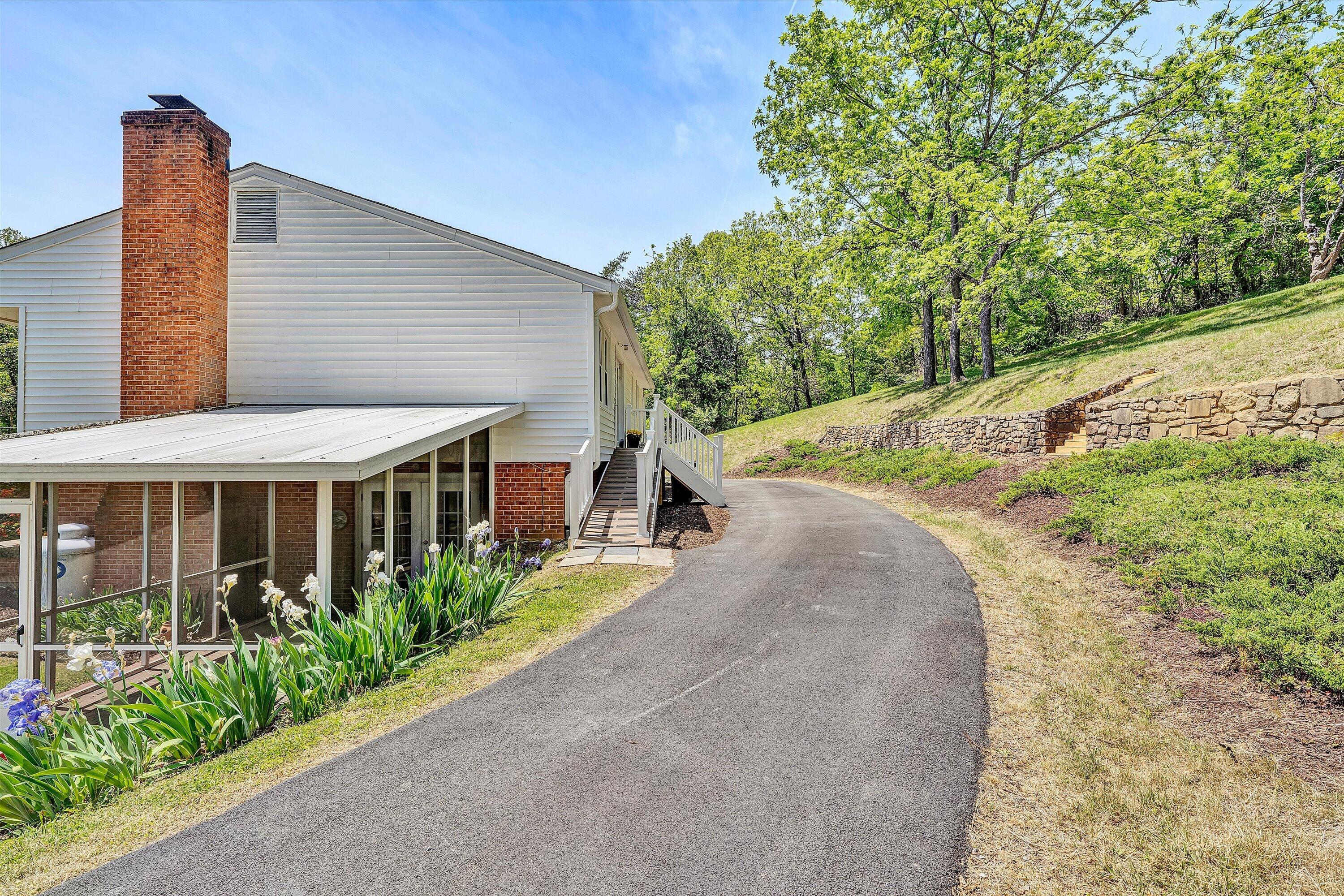 133 Kelsey Way Fincastle, VA 24090 - Photo 43 of 58 a view of a house with brick walls and plants