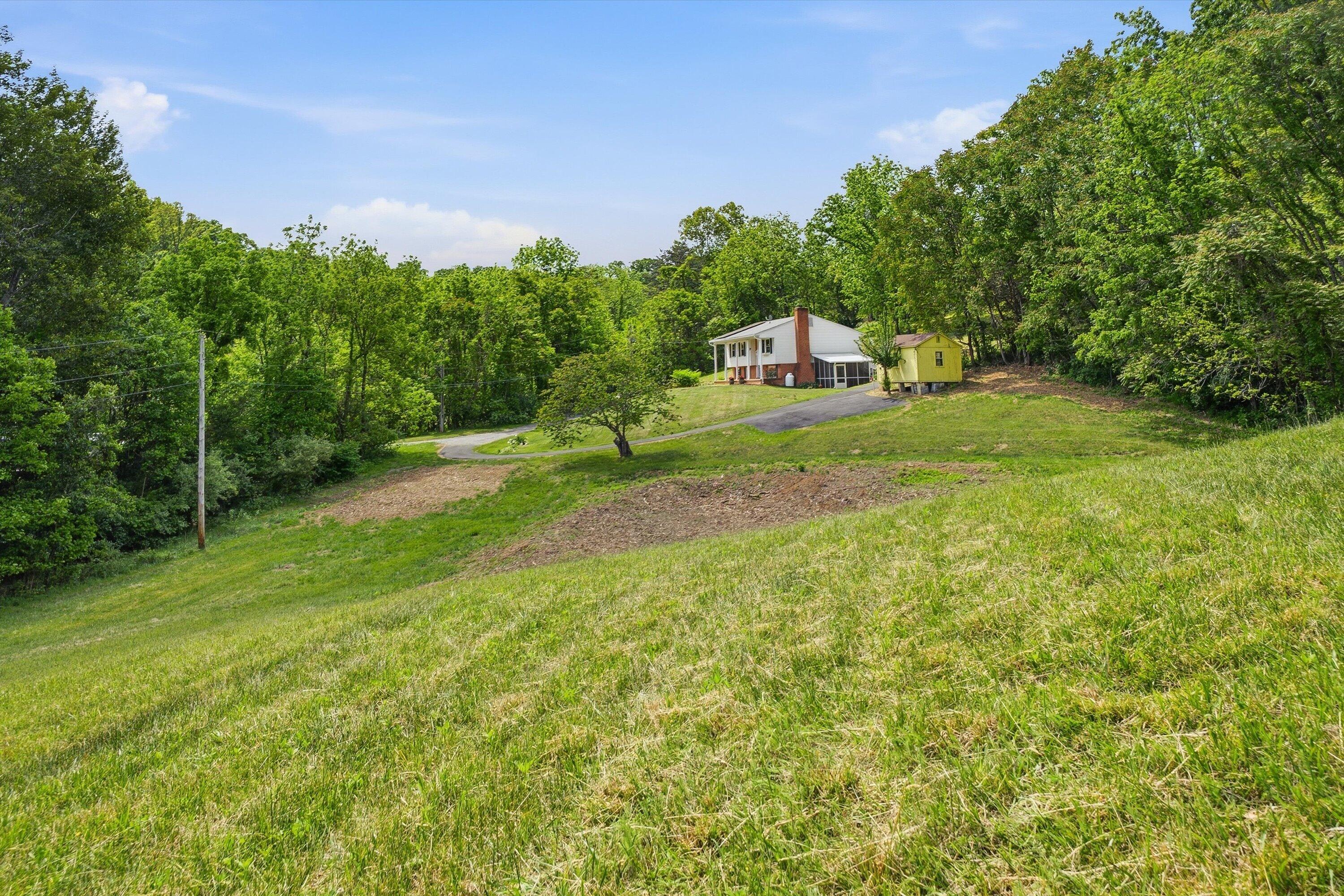 133 Kelsey Way Fincastle, VA 24090 - Photo 49 of 58 a green field with lots of trees in it