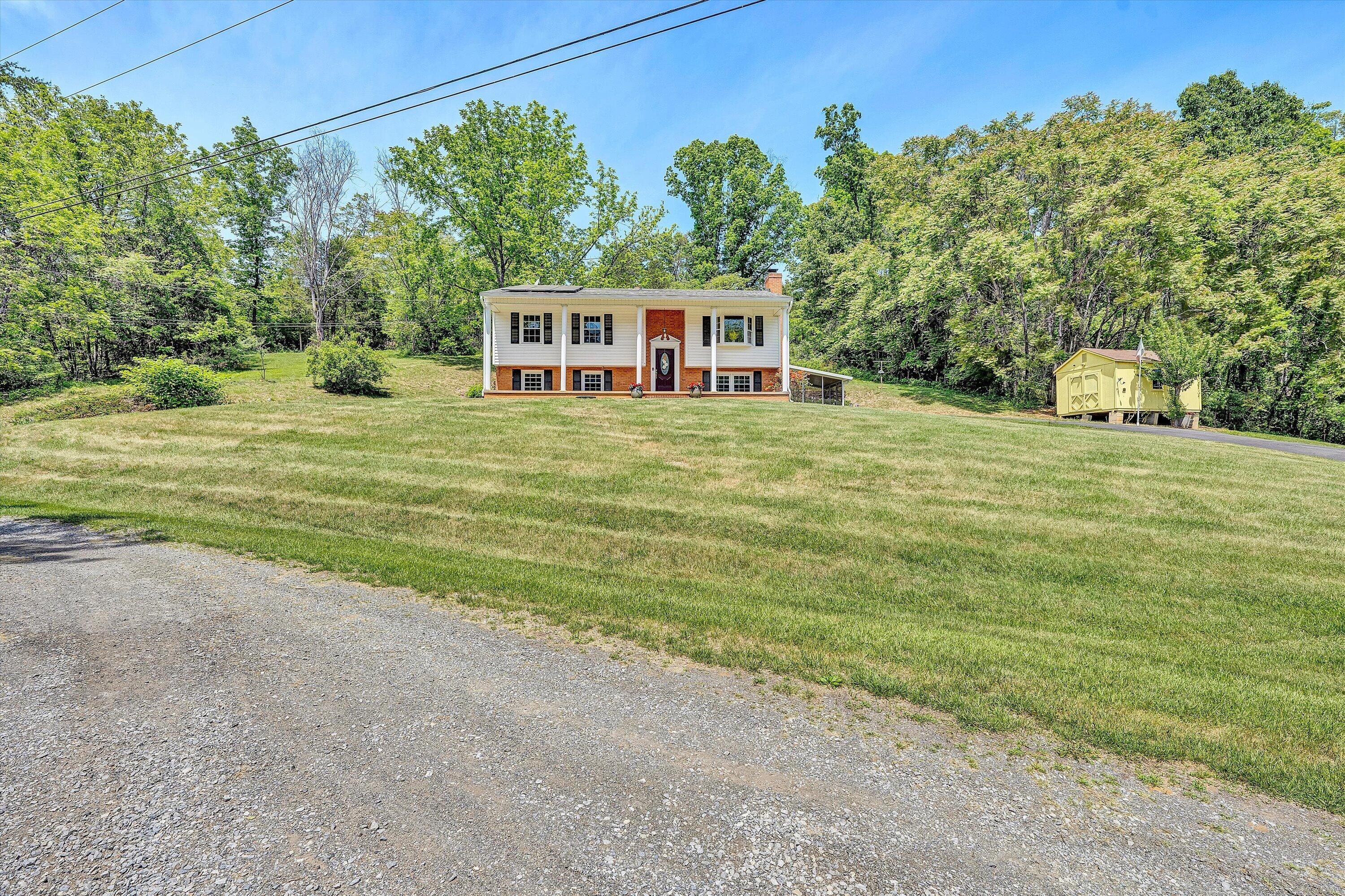 133 Kelsey Way Fincastle, VA 24090 - Photo 57 of 58 a front view of a house with a yard