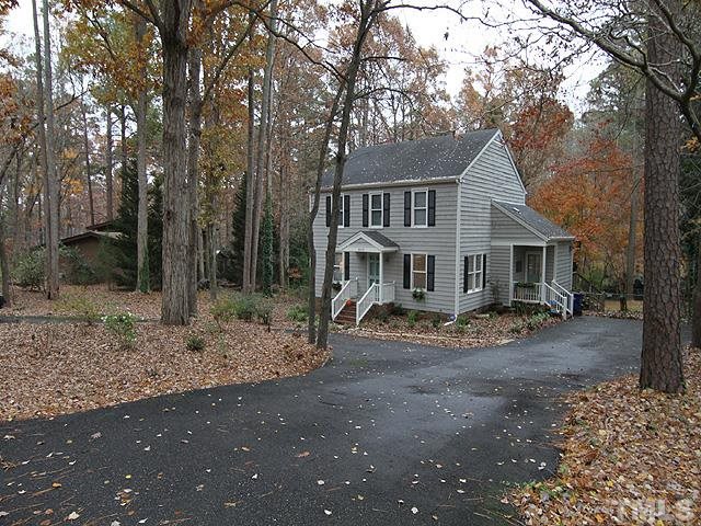 3512 Old Post Road Raleigh, NC 27612 - Photo 3 of 25 a view of a house with a yard