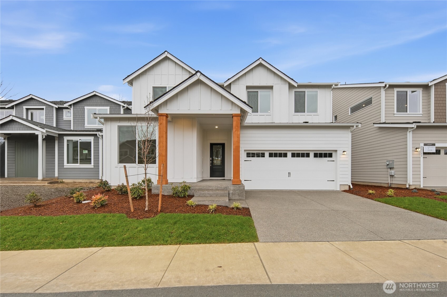 20145 135th Place Southeast Monroe, WA 98272 - Photo 1 of 19 a front view of a house with a yard and garage
