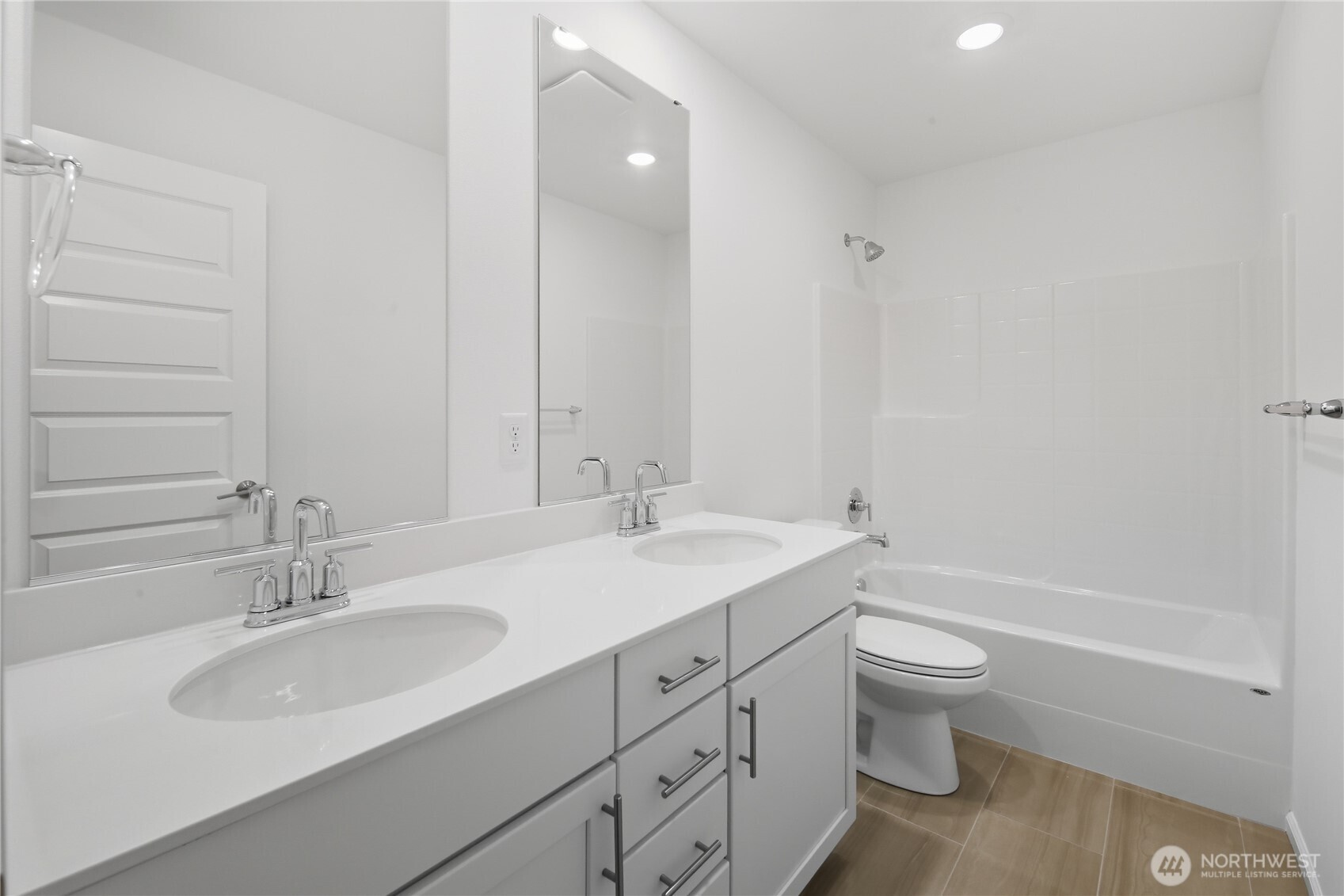 20145 135th Place Southeast Monroe, WA 98272 - Photo 12 of 19 a bathroom with a granite countertop sink toilet a large mirror a bathtub and shower