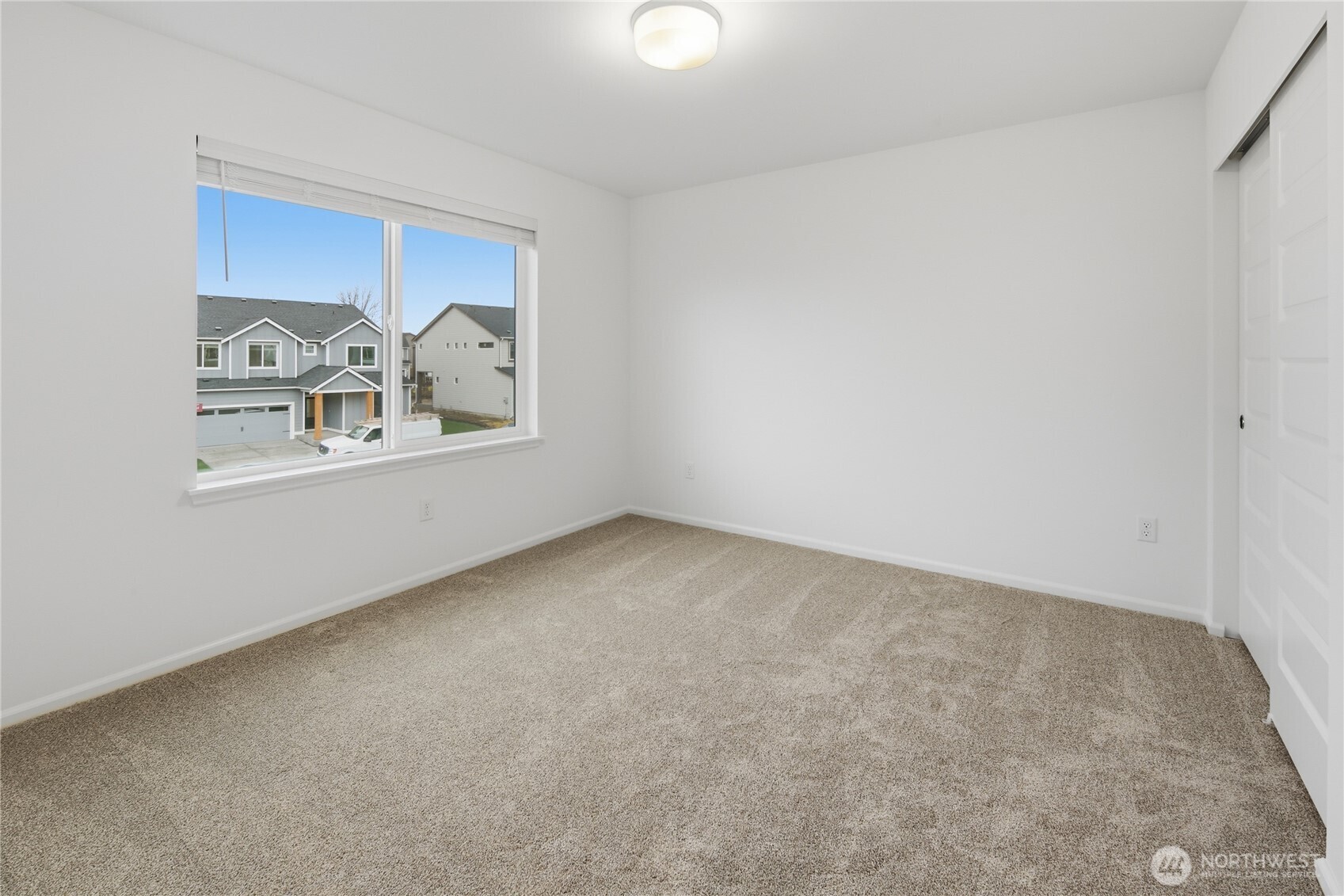 20145 135th Place Southeast Monroe, WA 98272 - Photo 13 of 19 an empty room with windows and couch