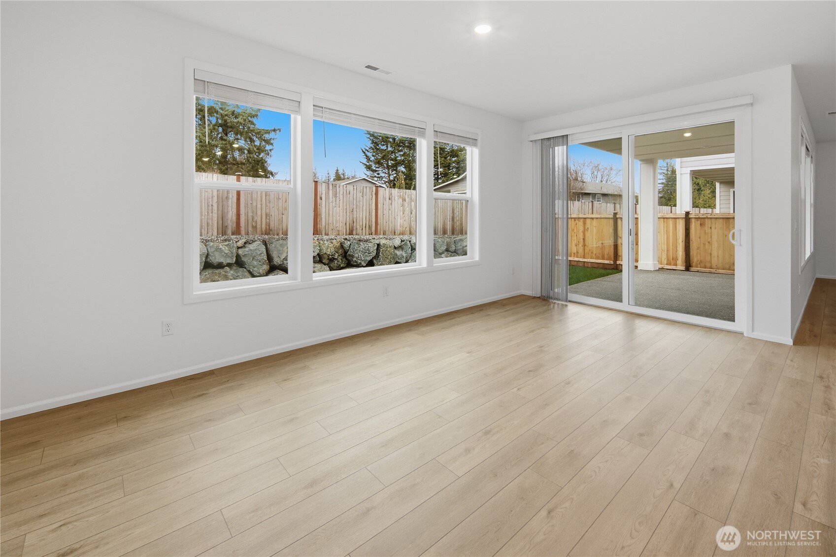 20145 135th Place Southeast Monroe, WA 98272 - Photo 5 of 19 an empty room with wooden floor and windows