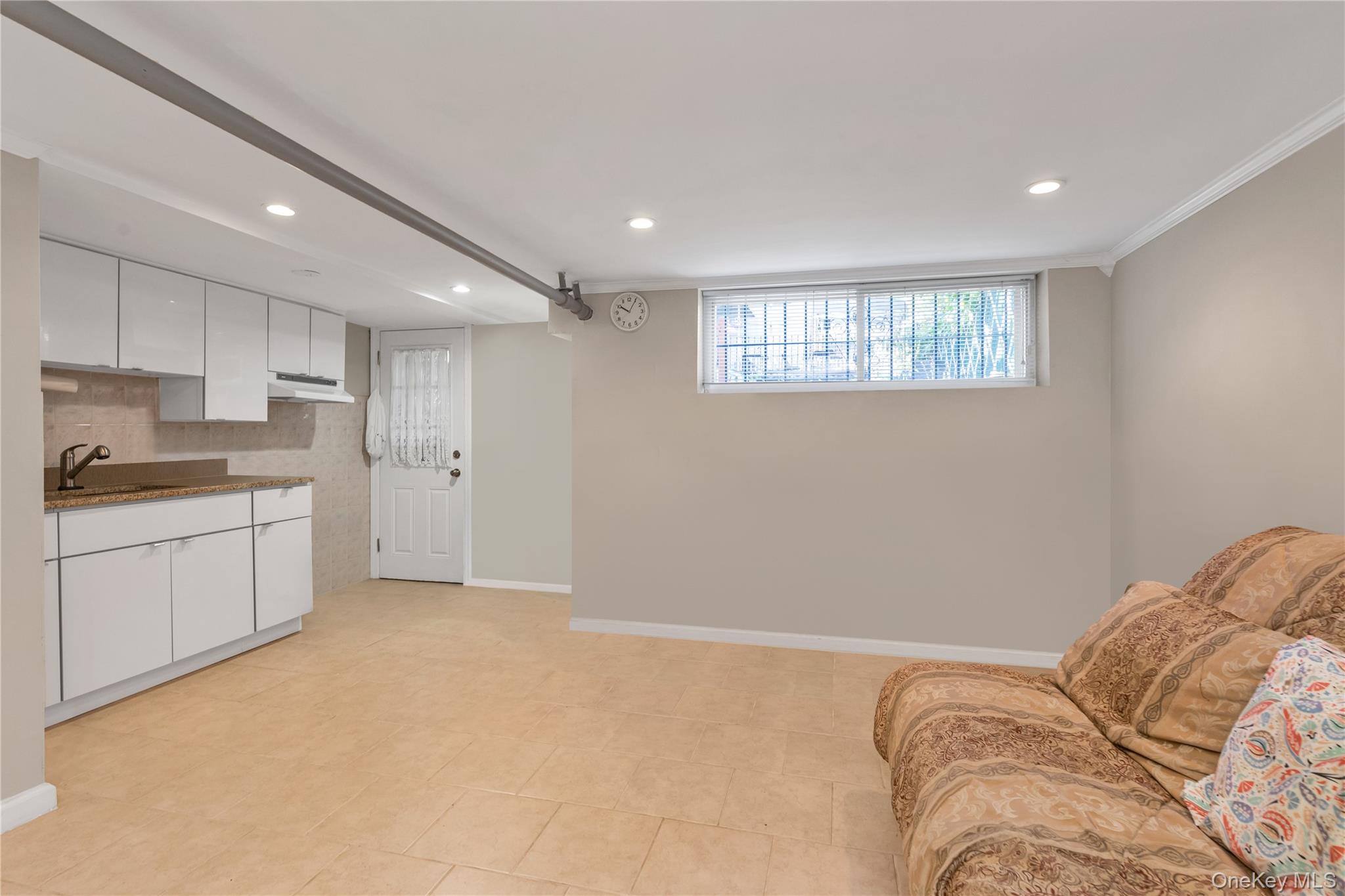 142-24 61st Road Queens, NY 11367 - Photo 13 of 18 Living area featuring recessed lighting and baseboards