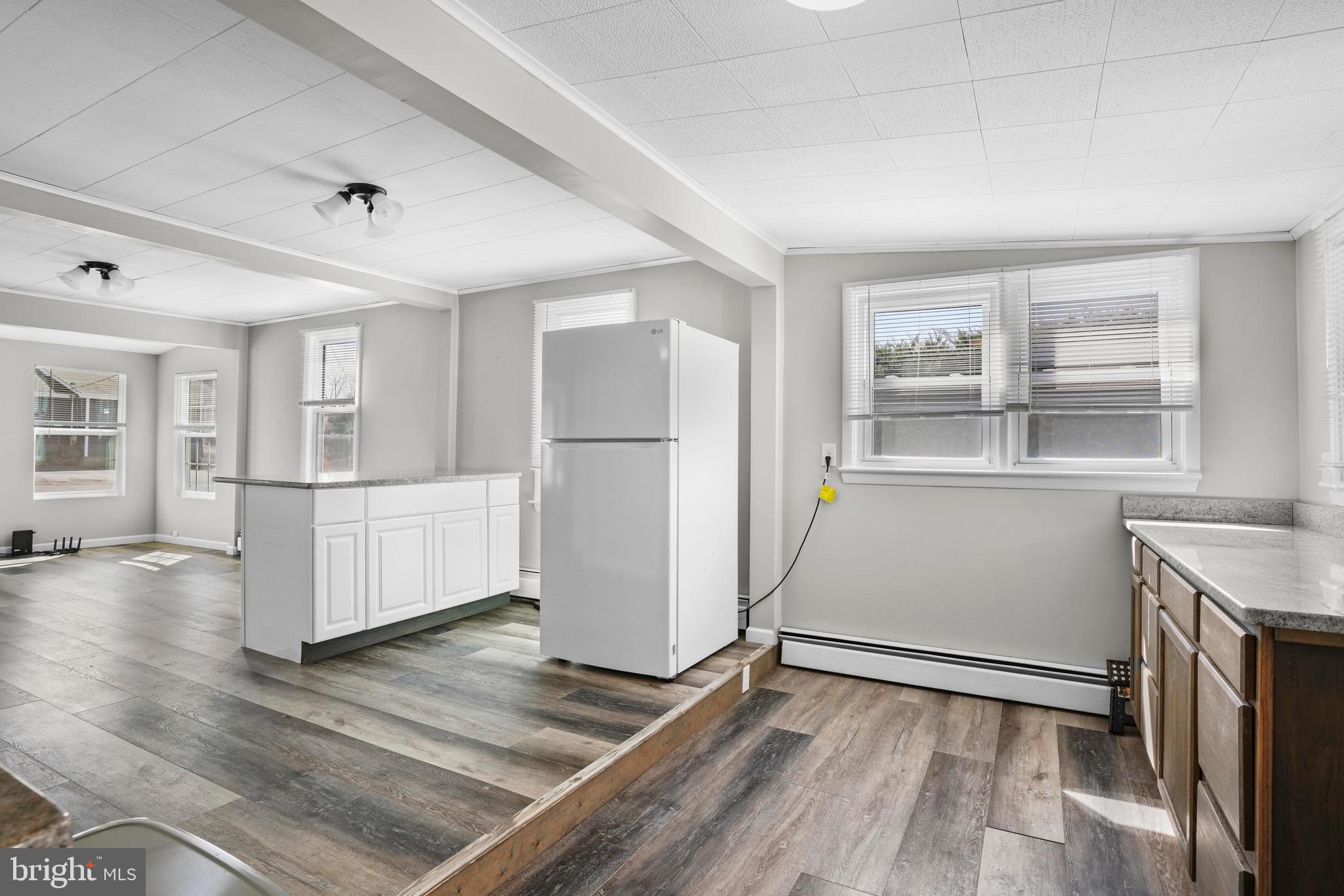 1816 Keymar Road Edgewater, MD 21037 - Photo 12 of 39 a view of a kitchen with furniture and wooden floor