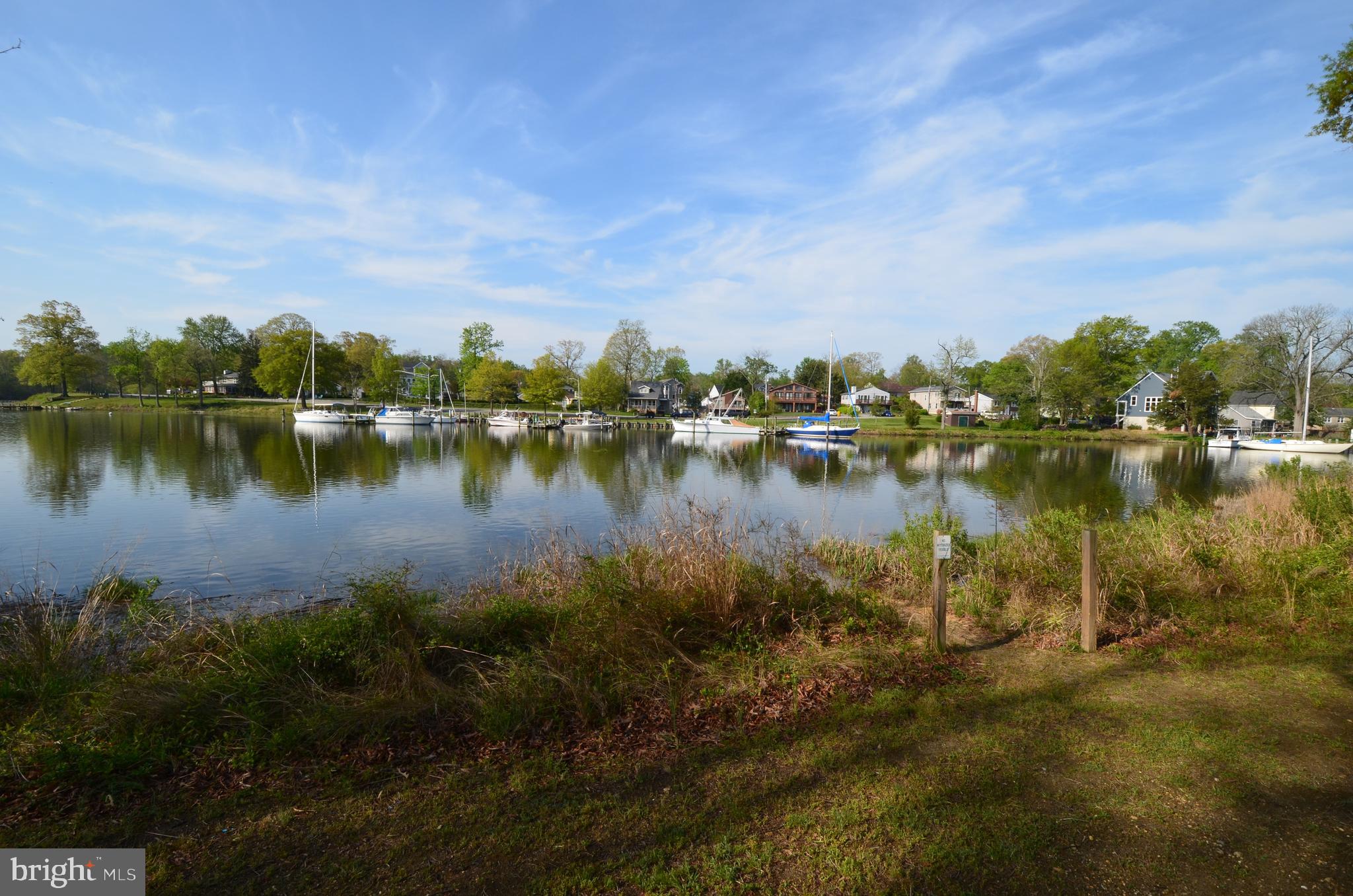 1816 Keymar Road Edgewater, MD 21037 - Photo 32 of 39 a view of a lake with houses in the back