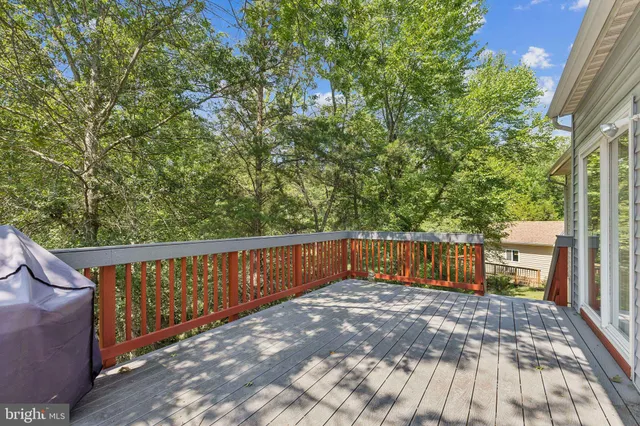 a balcony with trees in front of it