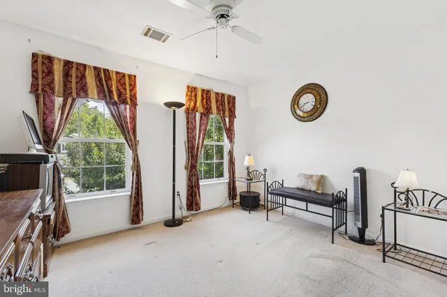 a view of livingroom with furniture and floor to ceiling window