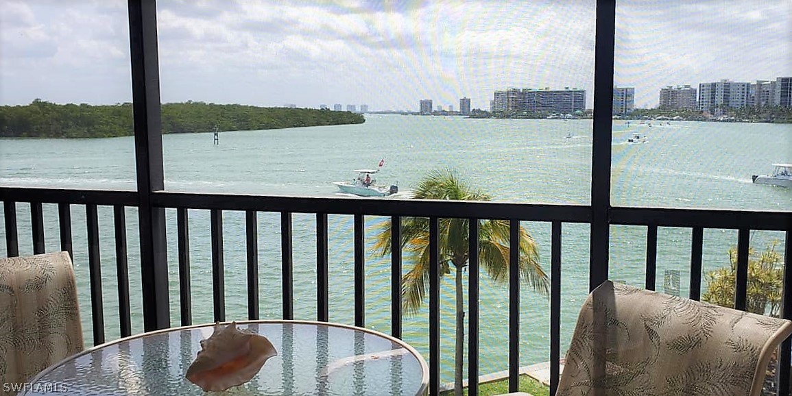 400 Lenell Road, Unit 207 Fort Myers Beach, FL 33931 - Photo 1 of 16 a balcony with street view