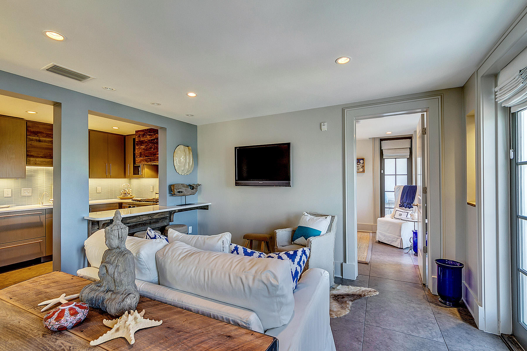 5 Main Street, Unit 1D Rosemary Beach, FL 32461 - Photo 16 of 29 a living room with furniture and a flat screen tv