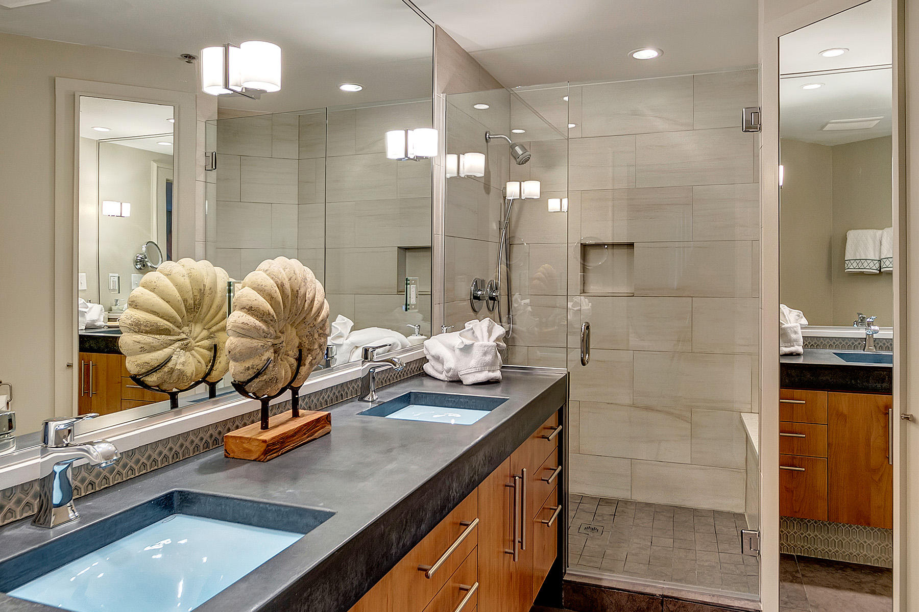 5 Main Street, Unit 1D Rosemary Beach, FL 32461 - Photo 19 of 29 a bathroom with a granite countertop sink a mirror and a shower