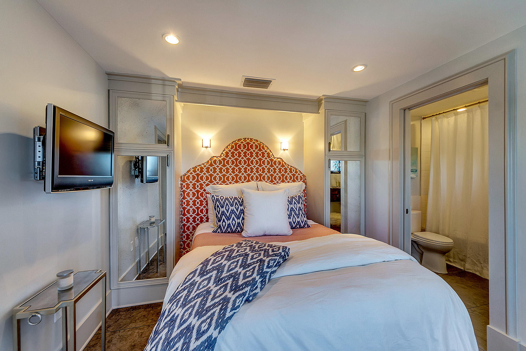 5 Main Street, Unit 1D Rosemary Beach, FL 32461 - Photo 24 of 29 a bedroom with a bed and a flat screen tv