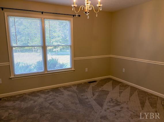 202 Hounds Run Forest, VA 24551 - Photo 22 of 38 a view of a room with rack on the wall and a window