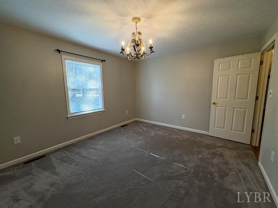 202 Hounds Run Forest, VA 24551 - Photo 23 of 38 en empty room with windows and chandelier