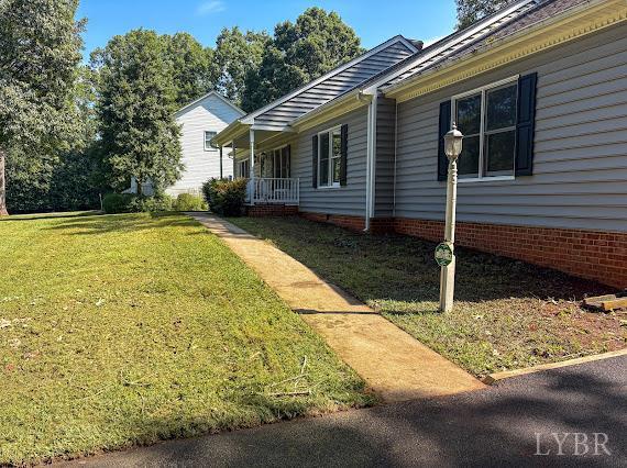 202 Hounds Run Forest, VA 24551 - Photo 3 of 38 a view of house with backyard and trees in the background