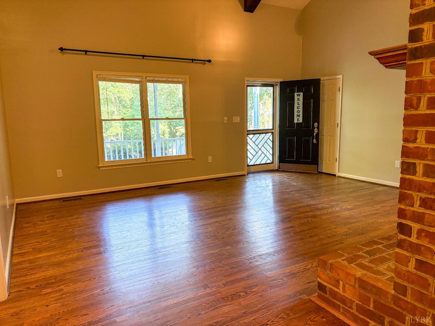 202 Hounds Run Forest, VA 24551 - Photo 6 of 38 a view of an empty room with window and wooden floor