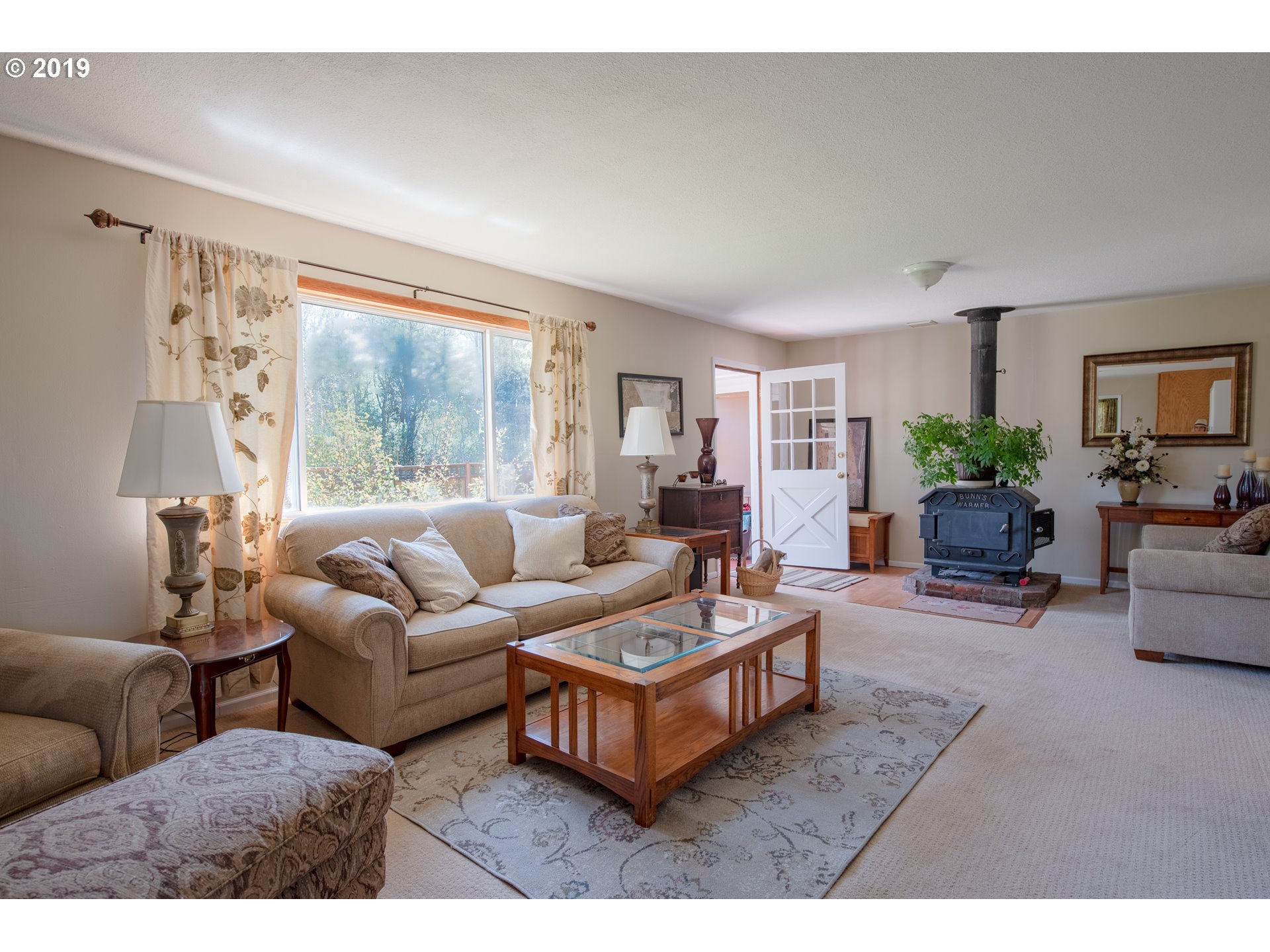 581 Snowden Road White Salmon, WA 98672 - Photo 4 of 27 a living room with furniture and a large window