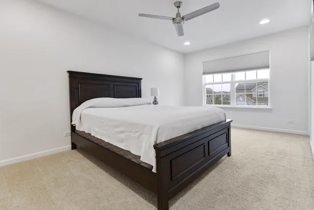 a bedroom with a bed and window