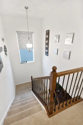 a view of staircase with white walls